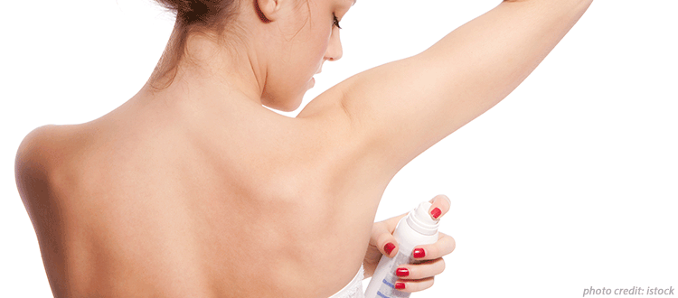 Women applying deodorant