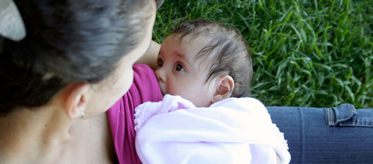 woman nursing her baby